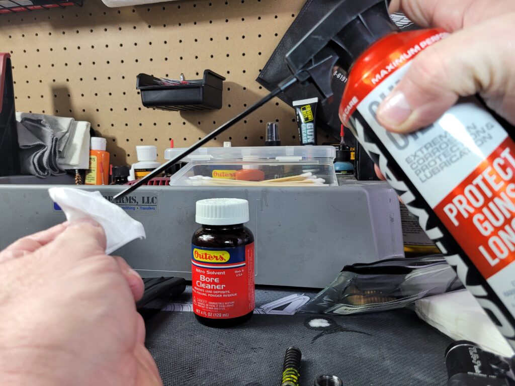applying gun oil to patch