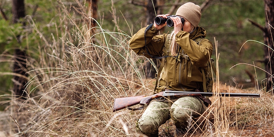 Woman hunter scouting game