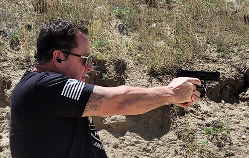 Shooting HK VP9 with AXIL hearing protection