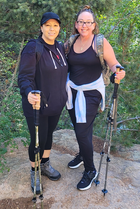 Friends hiking with trekking poles
